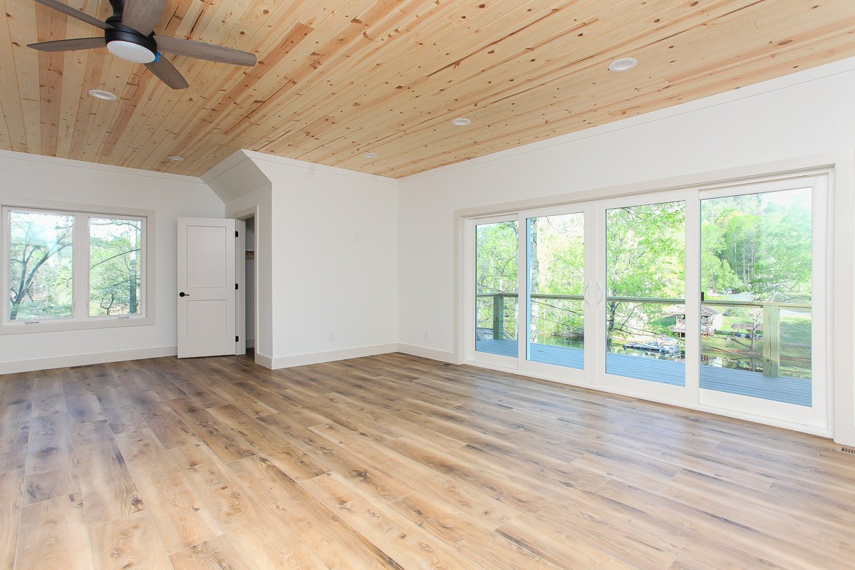 Upstairs in garage apartment open loft in garage apartment with sliding glass doors to deck overlooking lake