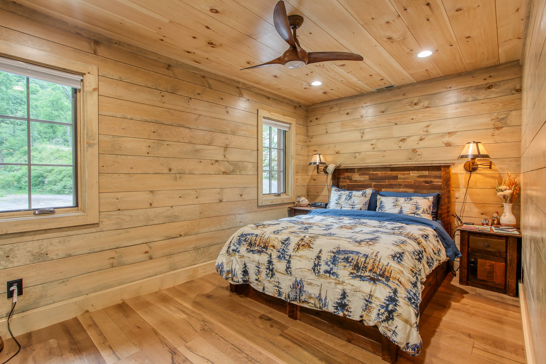 finished bedroom with shiplap walls and cieling
