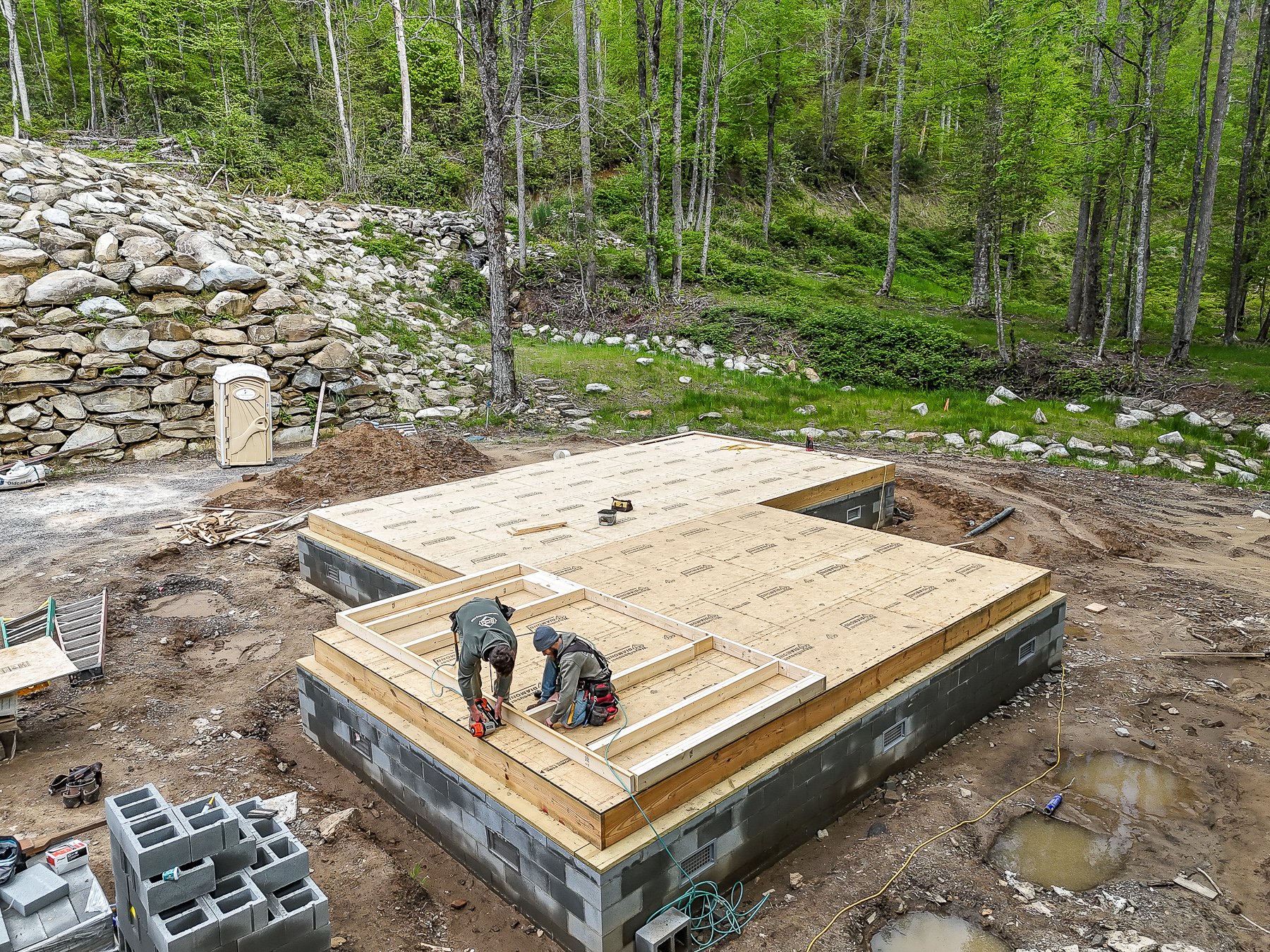 rcm construction crew framing new cabin after deconstruction of old one
